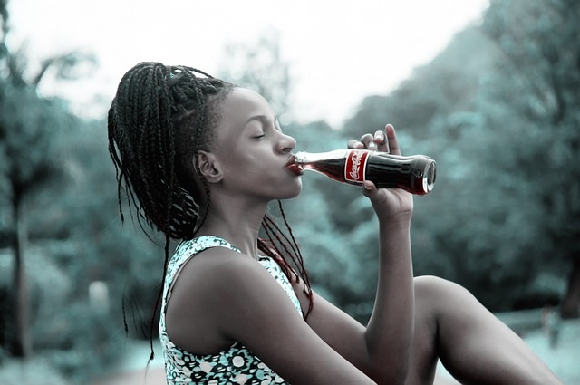Girl drinking Coke